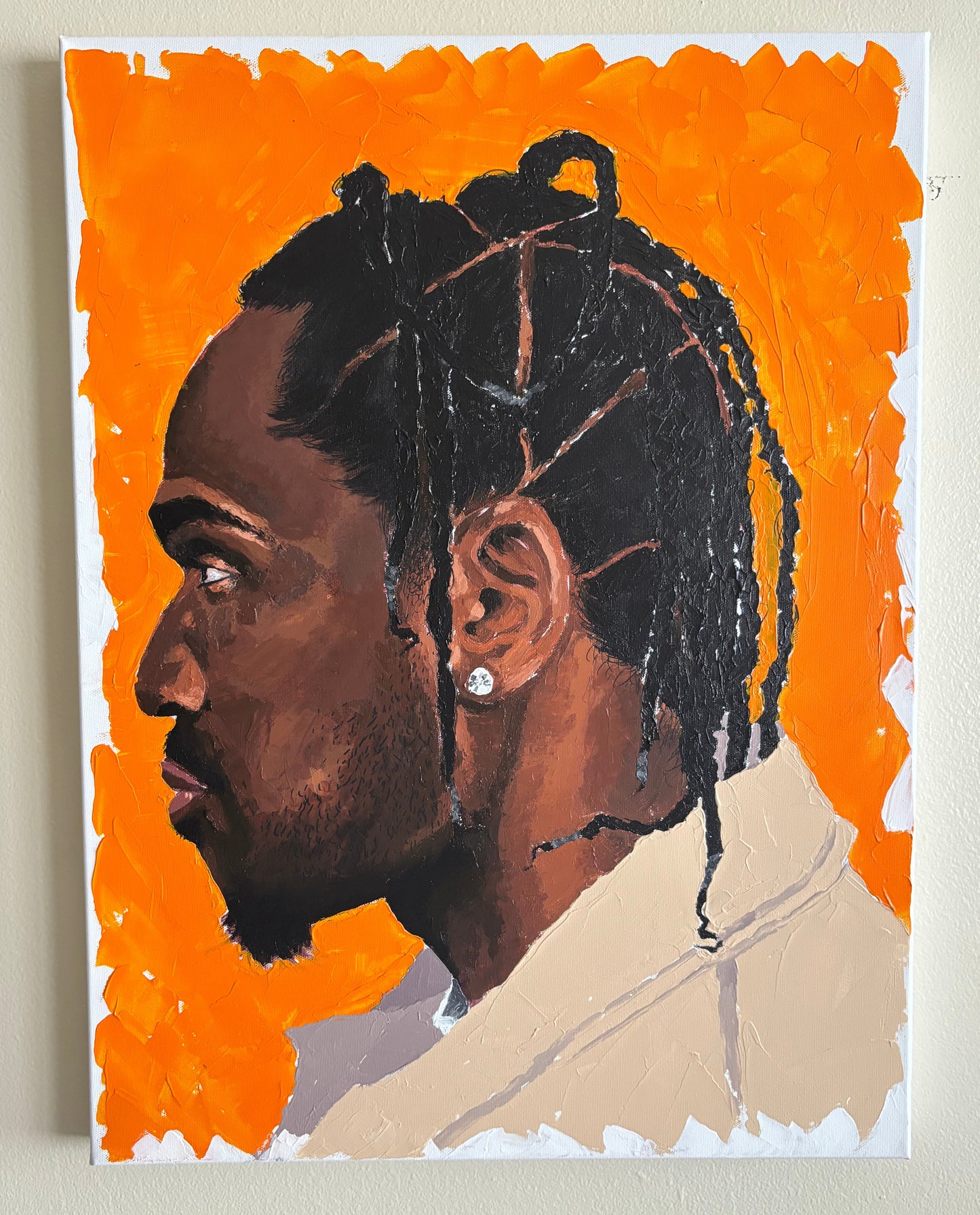 Abstract artwork with a face on an orange background